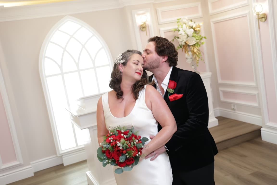 Karson kissing Natalie on the cheek in the chapel