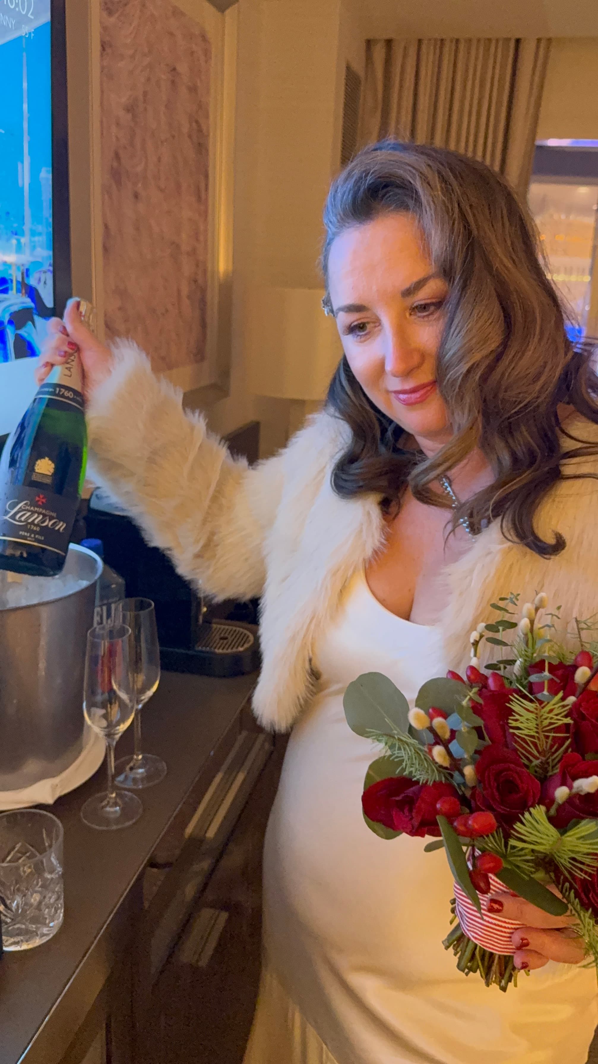 Natalie pouring champagne
