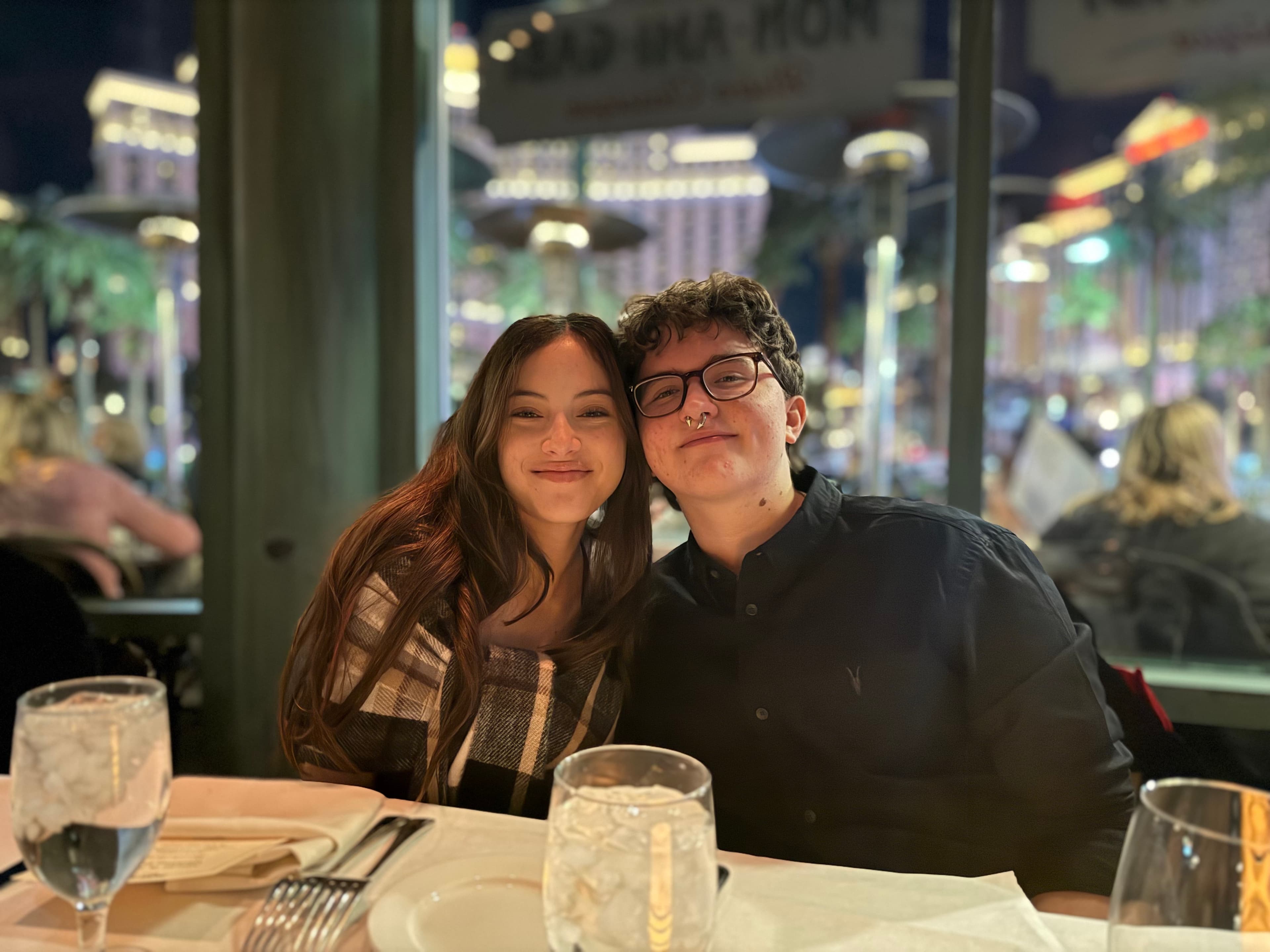 Kids at dinner with the Strip behind them